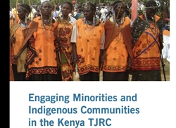 [ai] A group of women wearing traditional orange attire with decorative beading, standing together in a crowd, with a banner below that reads 'Engaging Minorities and Indigenous Communities in the Kenya TJRC'.